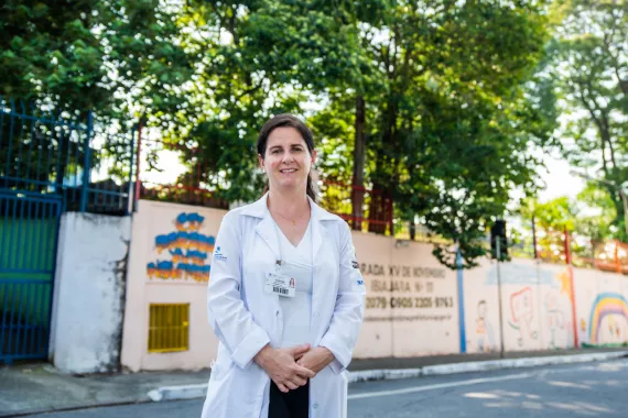 A Brazilian physician working in the field of cardiovascular disease is standing on a street in São Paulo A Brazilian physician working in the field of cardiovascular disease is standing on a street in São Paulo