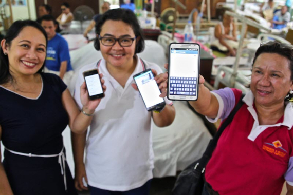 Image of three women presenting LEARNS App on their mobile phones