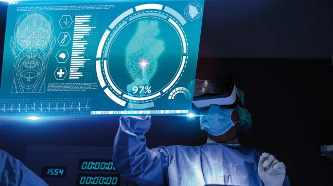 HealthTech person with virtual reality glasses typing in front of a screen typing on a dashboard